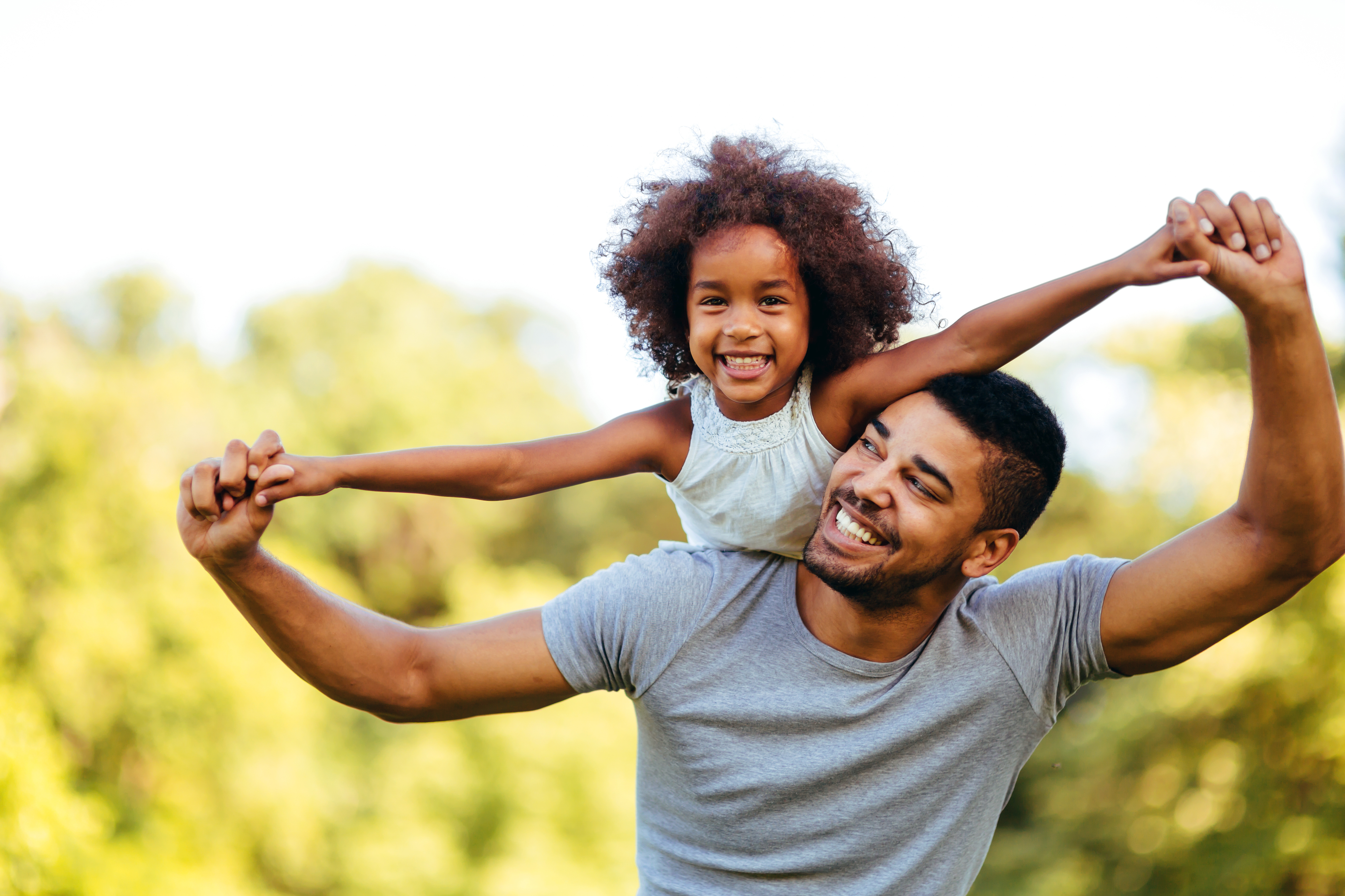 Father and daughter smiling