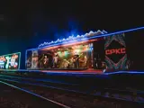 Train car lit up with Christmas lights