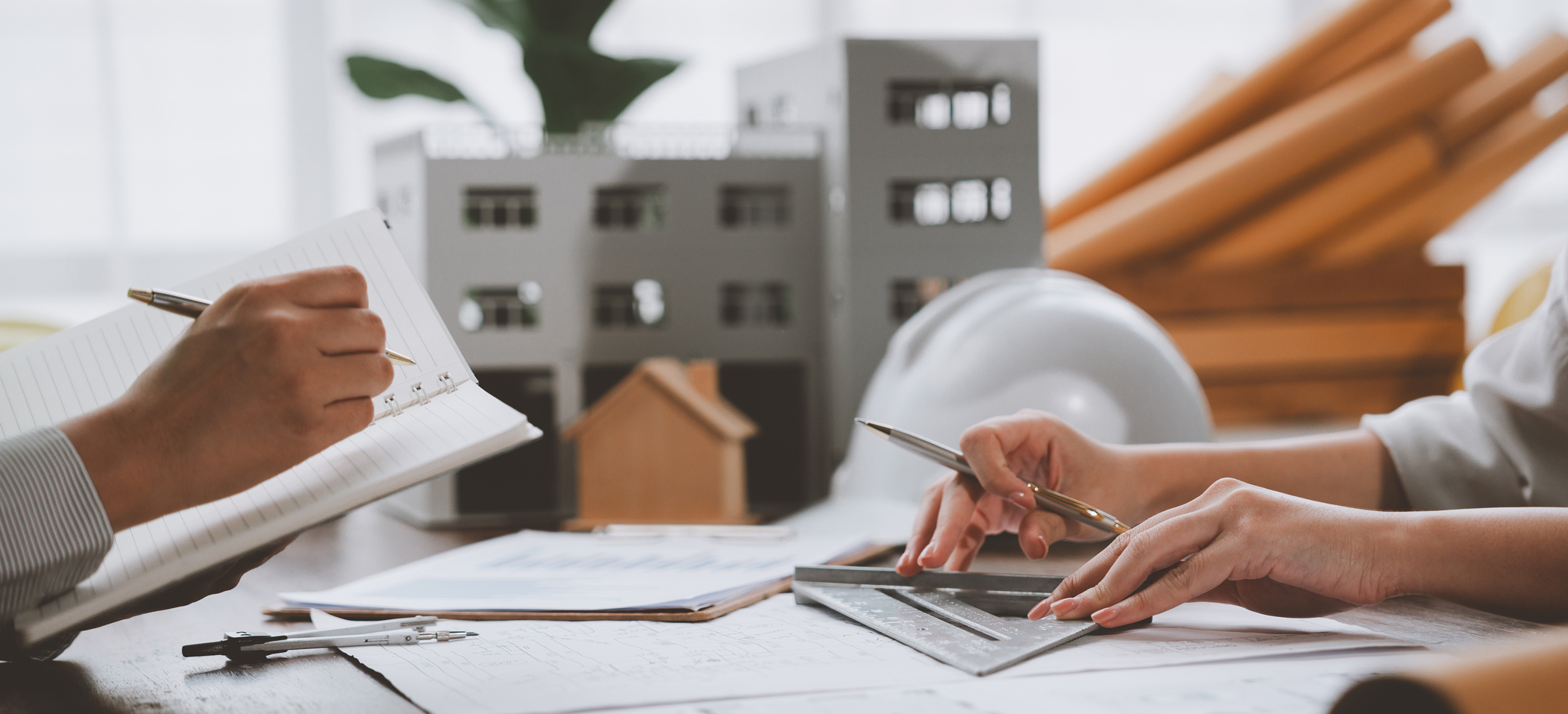 two people looking at a blueprint