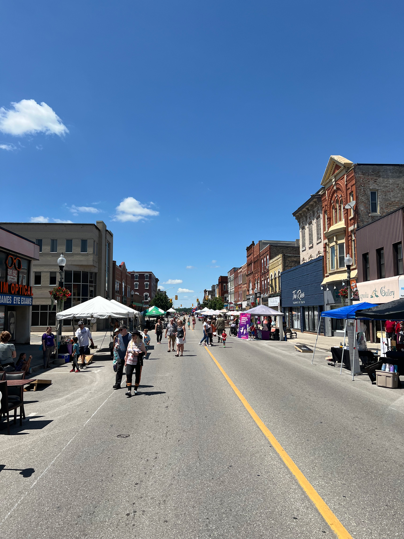 people walking down downtown woodstock 